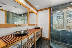 a bathroom with a sink and a shower at A Tide that Binds Us By Beachside Management in Siesta Key +78 photos