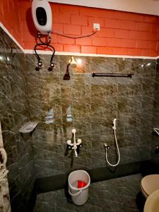 Koupelna v ubytování Srishti Home Stay