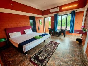 Postel nebo postele na pokoji v ubytování Srishti Home Stay