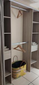 a closet with a bag in the middle of it at Fleur de Canne in Saint-Pierre