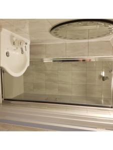a glass window of a bathroom with a sink at KGT House in Dublin +291 photos