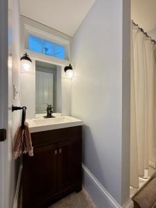 a bathroom with a sink and a mirror at Townhouse in Portsmouth Downtown Historic District in Portsmouth +76 photos