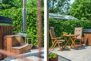 Billede fra billedgalleriet på Gastsuite het Duinroosje met hottub op het privé terras! i Den Burg