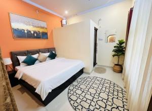 Ένα ή περισσότερα κρεβάτια σε δωμάτιο στο J S INN Hotel