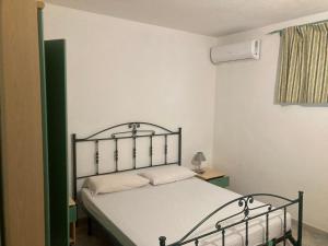 Ένα ή περισσότερα κρεβάτια σε δωμάτιο στο Olivastro