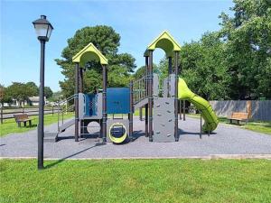 a playground with a slide in a park at Cozy, private room near Virginia Beach town center in Virginia Beach