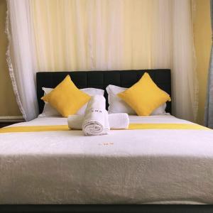 Ένα ή περισσότερα κρεβάτια σε δωμάτιο στο Zerubbabel Apartmerns B002