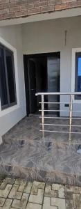 a balcony of a building with a black door at Kaduna Laidos shortlet Appartment in Kaduna