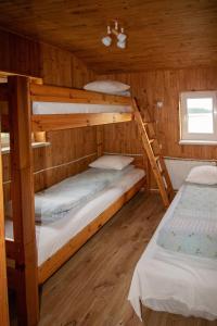 Postel nebo postele na pokoji v ubytování Kurzemes pērle