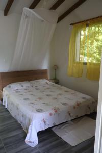 Postel nebo postele na pokoji v ubytování Bungalow Milo