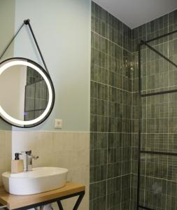 a bathroom with a sink and a mirror at Park home in Baia Mare +14 photos
