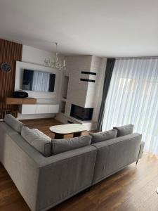 a living room with a couch and a table at Villa Marina in Novoberdo