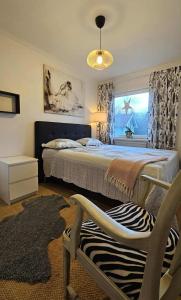 Ένα ή περισσότερα κρεβάτια σε δωμάτιο στο Little Cabin