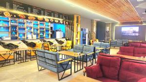 a restaurant with tables and chairs in a room at Xetai Royal Hotel & Restaurant in Baku +68 photos