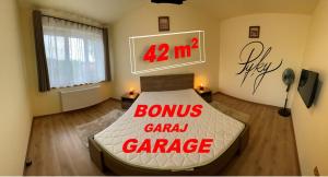 a bedroom with a bed with a sign on it at Pyky in Baia Mare