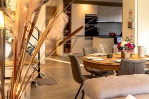 a dining room with a table and chairs at Charmant chalet, spacieux, proche du lac, vue sur la montagne in Gérardmer