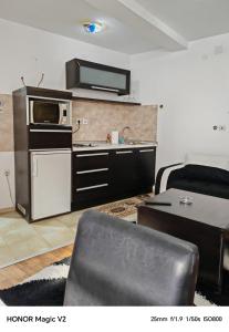 Kuchyň nebo kuchyňský kout v ubytování NikolinA