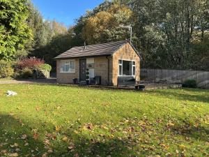 a small house in the middle of a yard at Towneley Lodge, Burnley in Burnley