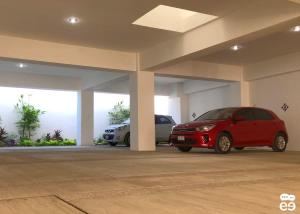 un coche rojo está aparcado en un garaje en Apartment with pool 3 blocks from the beach, en Isla Venados