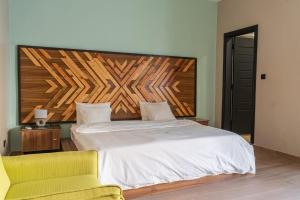 Postel nebo postele na pokoji v ubytování Ouakam Monument de la Renaissance