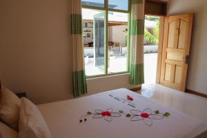 Postel nebo postele na pokoji v ubytování Shifa Lodge Maldives