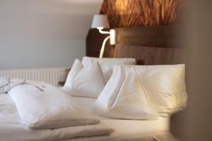 Postel nebo postele na pokoji v ubytování Die Landhofmühle + 12 fotografií