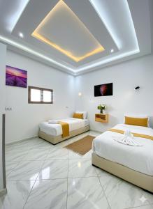 Postel nebo postele na pokoji v ubytování Hotel America Apartments