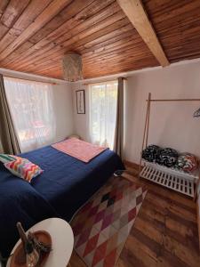 Voodi või voodid majutusasutuse Hostal waiwen toas