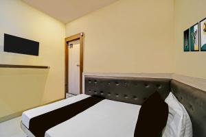 Ένα ή περισσότερα κρεβάτια σε δωμάτιο στο Hotel O Sanjay +21 φωτογραφίες