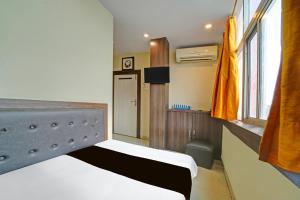 Ένα ή περισσότερα κρεβάτια σε δωμάτιο στο Hotel O Sanjay