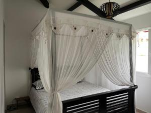 En eller flere senge i et værelse på VILLA ZEN