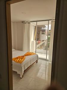 Ένα ή περισσότερα κρεβάτια σε δωμάτιο στο Apto N 302 vacacional