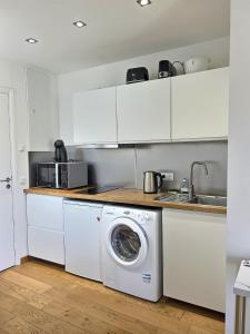 Kuchyň nebo kuchyňský kout v ubytování Studio centre Aix - Climatisé avec terrasse