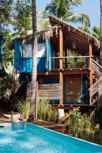 a resort with a swimming pool and a house at H20 Hotel Container in San Agustinillo +24 photos