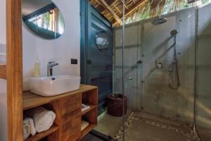 a bathroom with a sink and a shower at H20 Hotel Container in San Agustinillo