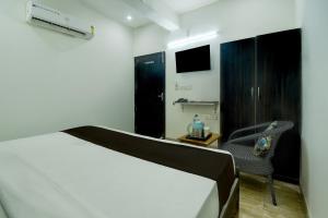 Ένα ή περισσότερα κρεβάτια σε δωμάτιο στο Hotel O H Pass +39 φωτογραφίες