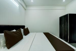 Ένα ή περισσότερα κρεβάτια σε δωμάτιο στο Hotel O H Pass