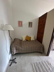 Ένα ή περισσότερα κρεβάτια σε δωμάτιο στο Alojamiento De Rocha