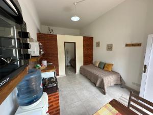 a room with a bed and a couch in it at Alojamiento De Rocha in Monte Grande
