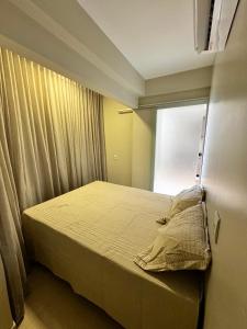 Ένα ή περισσότερα κρεβάτια σε δωμάτιο στο Apartamento Morais +23 φωτογραφίες