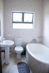 Ένα μπάνιο στο Moriti Inn Guest House