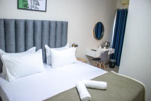 Ένα ή περισσότερα κρεβάτια σε δωμάτιο στο Moriti Inn Guest House