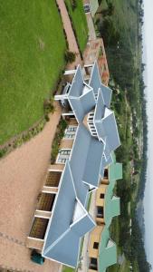 an aerial view of a row of houses on the water at Maison Royale Lodge in Nongoma