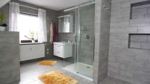 a bathroom with a shower and a sink at Ferienwohnung Kresse 