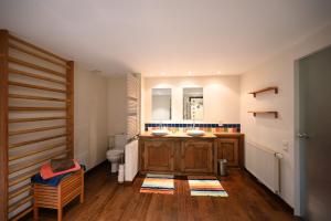 a bathroom with a sink and a toilet at Le Nid d'à côté in Méan +5 photos
