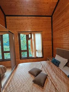 Postel nebo postele na pokoji v ubytování Serin Mekan Lerik