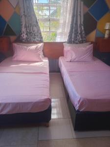 Postel nebo postele na pokoji v ubytování Love Den