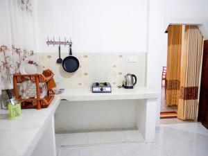 Kuchyň nebo kuchyňský kout v ubytování Thisaru Homestay + 22 fotografií