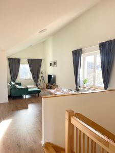a living room with a couch and a table at Cozy Atmos Apartments in Prague