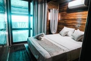 Postel nebo postele na pokoji v ubytování Cabaña Kokkos Del Mar + 4 fotografie